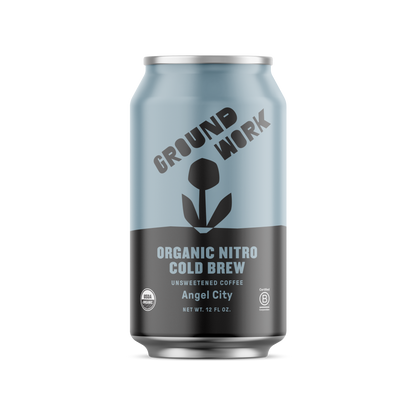 A silver and light blue 12 fl oz can of Groundwork Coffee Organic Angel City Nitro Cold Brew features a stylized plant graphic and offers a pure, creamy texture.