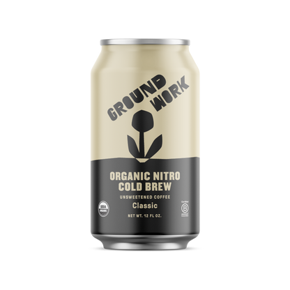 Groundwork Coffee Co Organic Classic Nitro Cold Brew is an unsweetened, creamy coffee in a beige and black can with a plant graphic—ideal for coffee lovers.