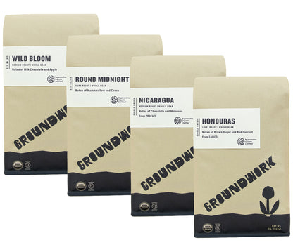 Four brown Groundwork Coffee bags labeled Regenerative Organic Certified® Coffee Bundle, featuring Honduras and Nicaragua coffees with unique names and flavor notes.