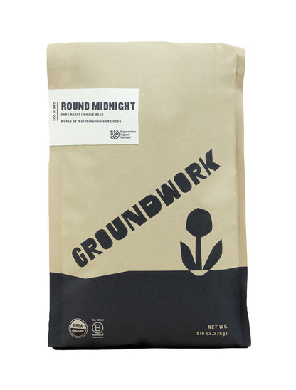 A brown 5 lb bag of Groundwork Coffee Regenerative Organic Certified® Round Midnight Dark Roast with marshmallow and cocoa notes, USDA Organic seal, and black flower graphic.