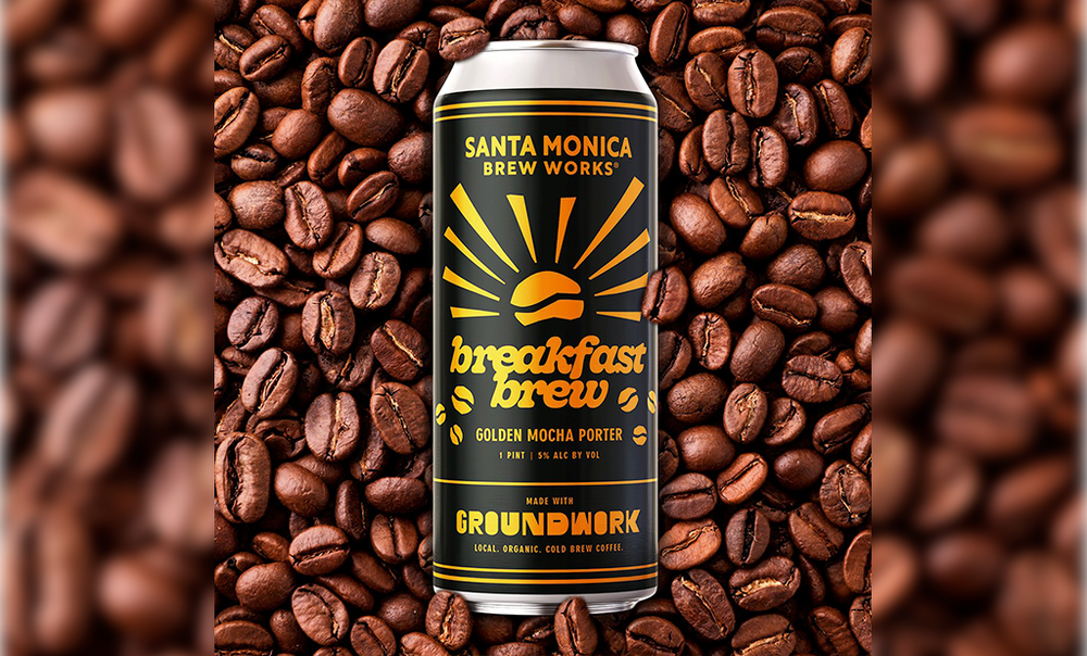 A can of Santa Monica Brew Works Breakfast Brew Golden Mocha Porter surrounded by coffee beans.