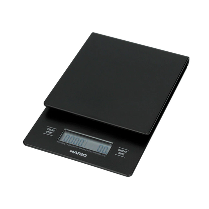 The Groundwork Coffee Hario V60 Drip Scale is a black, rectangular digital scale with LCD display, ideal for pour over coffee and timing your brew.