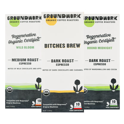 Three boxes of Groundwork Coffee’s Nespresso® Variety Pack—certified compostable pods in Wild Bloom, Bitches Brew & Round Midnight flavors with tasting notes.