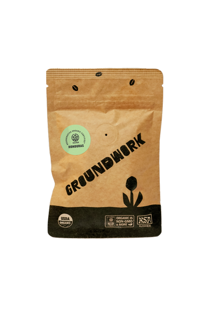 A brown bag of Groundwork Coffee Sample, labeled Single Origin Honduras with USDA Organic and BSA Roaster certifications on the front.