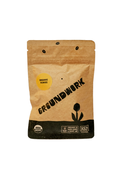 A brown Groundwork Coffee bag labeled Coffee Sample, featuring Signature Blends with USDA Organic, Fair Trade, and BSA Certified icons at the bottom.