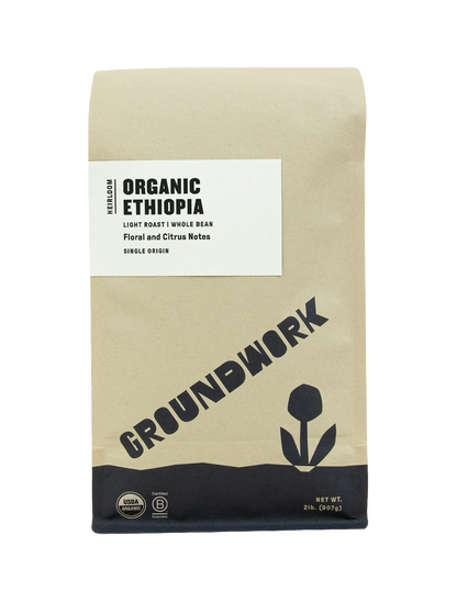 A brown bag of Groundwork Coffees Ethiopia: Heirloom Blend, whole bean, features floral and citrus notes with organic and USDA certified icons.