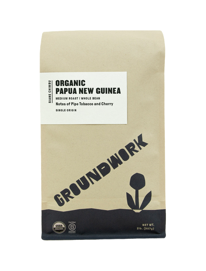 A brown bag of Groundwork Coffee Store Papua New Guinea: Siane Chimbu medium roast whole bean coffee with tasting notes of cherry and pipe tobacco.