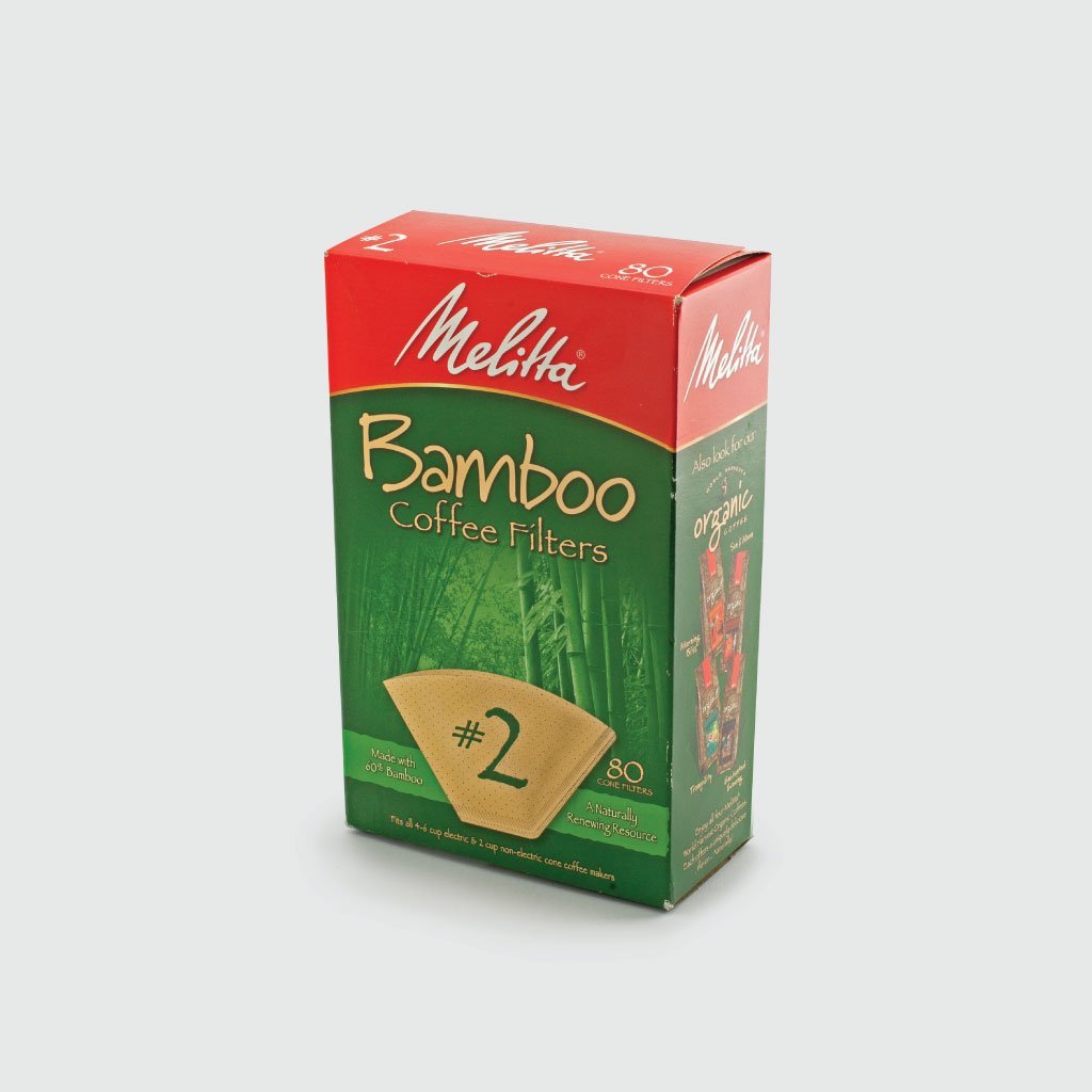 A box of Groundwork Coffee Melitta Bamboo Cone Coffee Filters, size #2, 80 count, in red and green bamboo-themed packaging; 100% chlorine free with micro fine perforations.