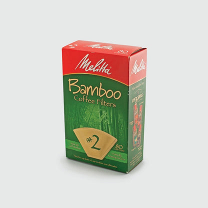 A box of Groundwork Coffee Melitta Bamboo Cone Coffee Filters, size #2, 80 count, in red and green bamboo-themed packaging; 100% chlorine free with micro fine perforations.